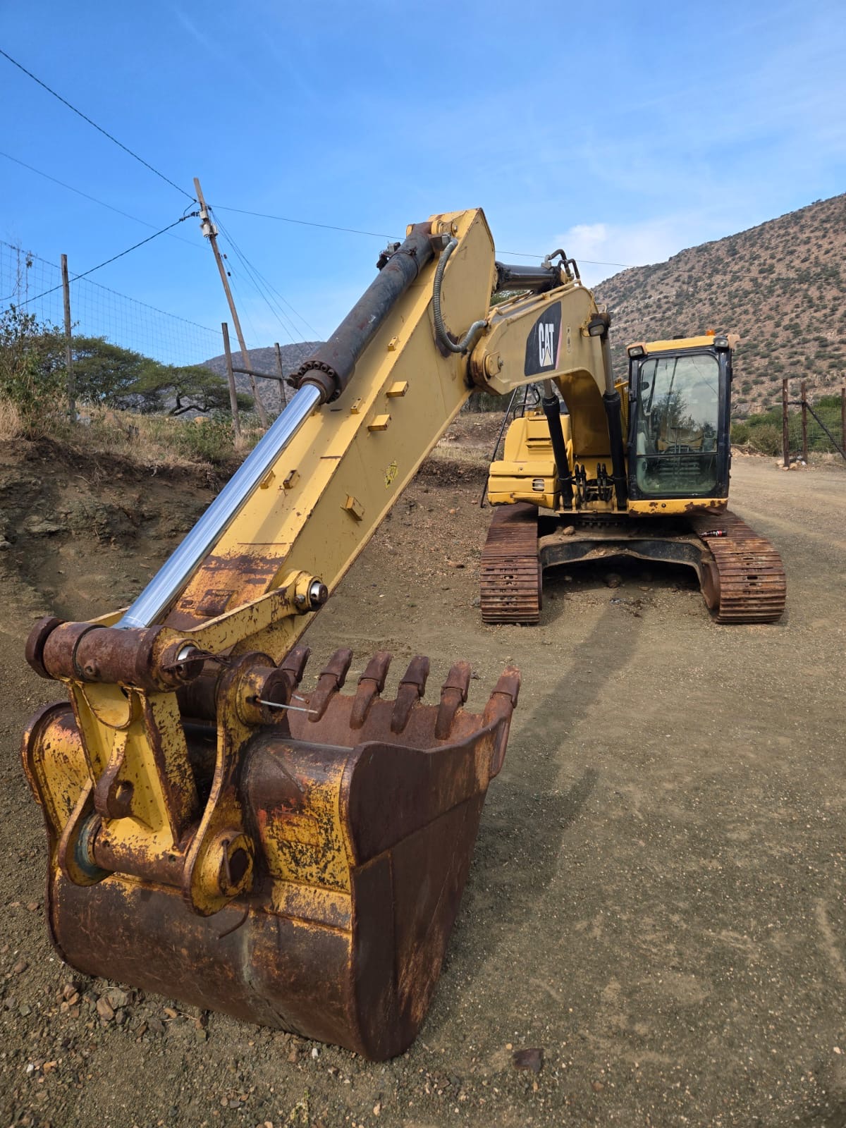 CAT Excavator — Bucket & Boom Close-up