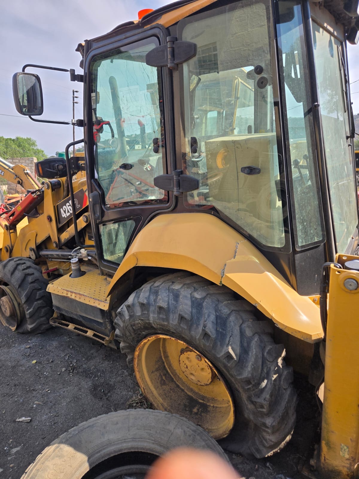 CAT 426E Backhoe Loader — Cab Close-up
